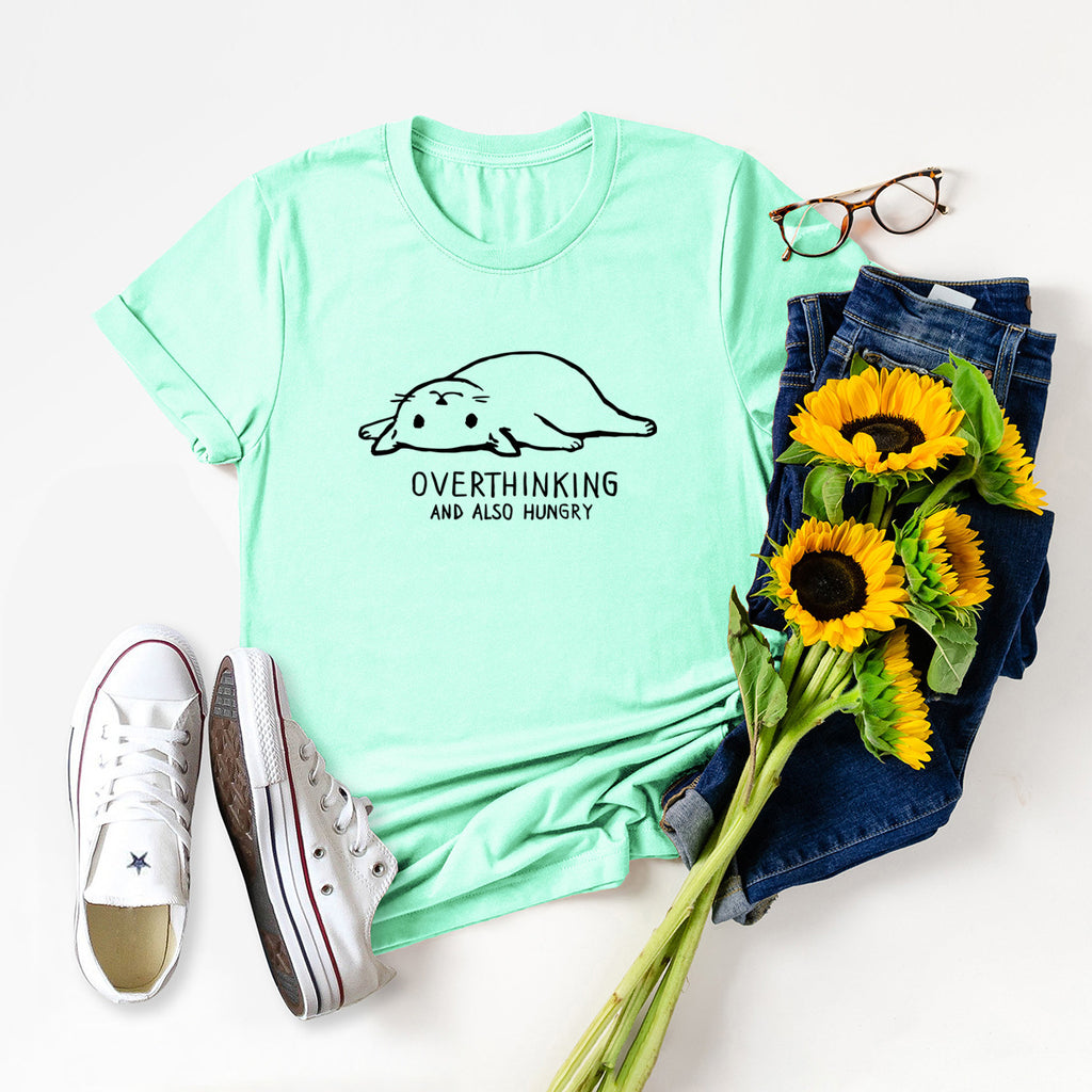 Cotton t-shirt with a fun cat lazy cat image: "Overthinking and also hungry" Light green