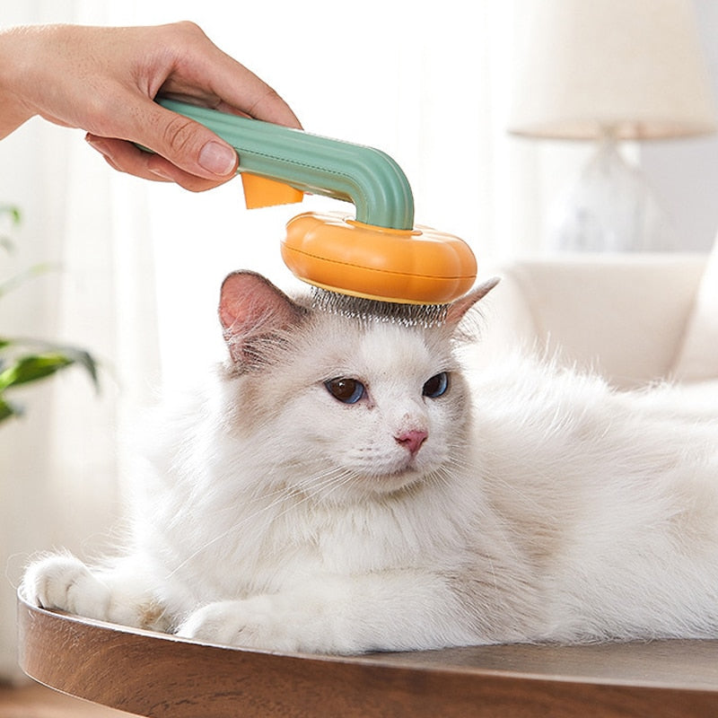 Cat comb removes loose underlayers and tangled hair. Cats love the slow massaging motion of this brush. Bristles have a safety feature, so they will not hurt sensitive skin of your kitty. Cute pumpkin design.  Button press releases fluff and fur for ease of cleaning, sturdy handle.  Ergonomic handle - easy to hold and to brush your pet.